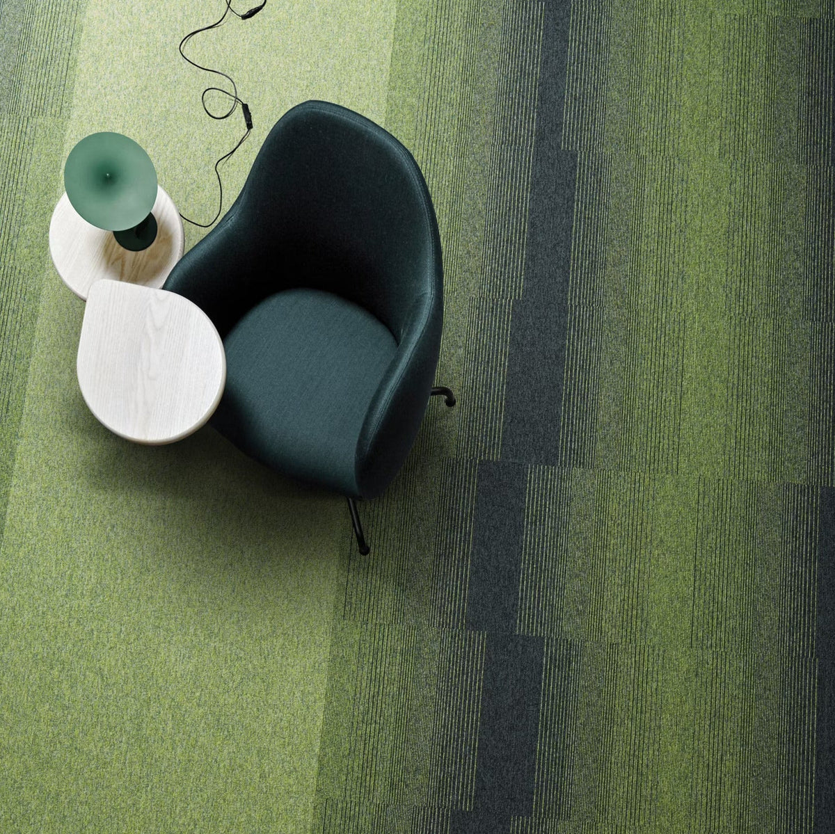 Interface Employ Lines Meadow carpet tiles with Employ Loop Kiwi and Jet in a lounge area