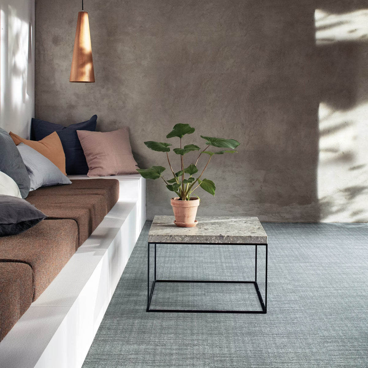 Interface Contemplation carpet tiles in Rustic laid in an ashlar pattern in a breakout area with bench seating