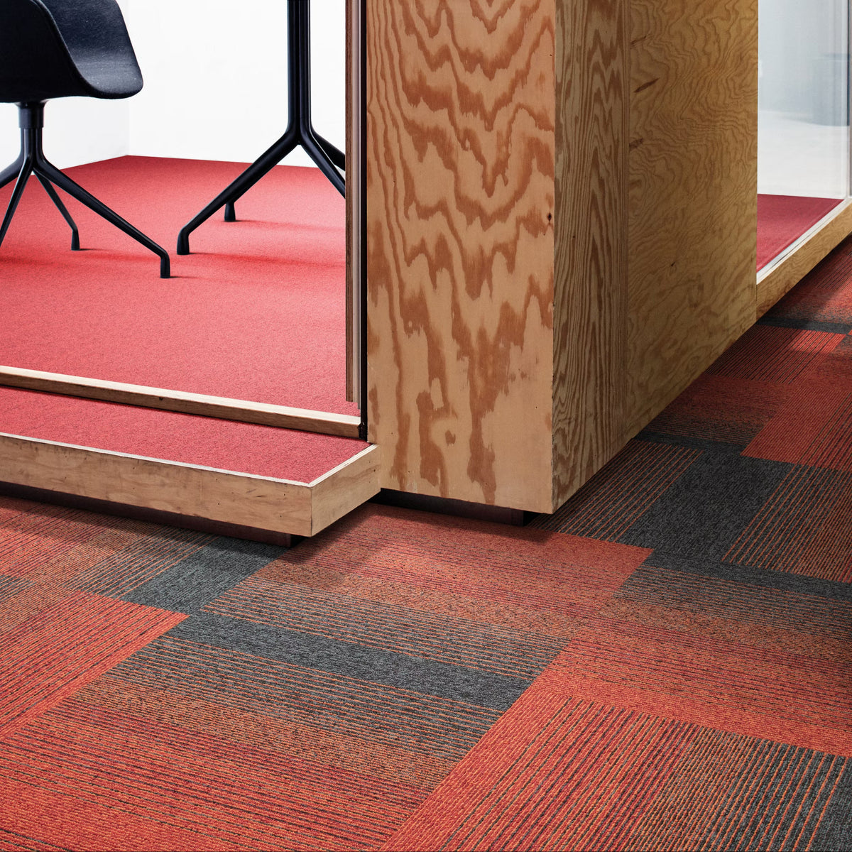 Interface Employ Lines Sunset carpet tiles with Employ Loop Salsa in a meeting pod