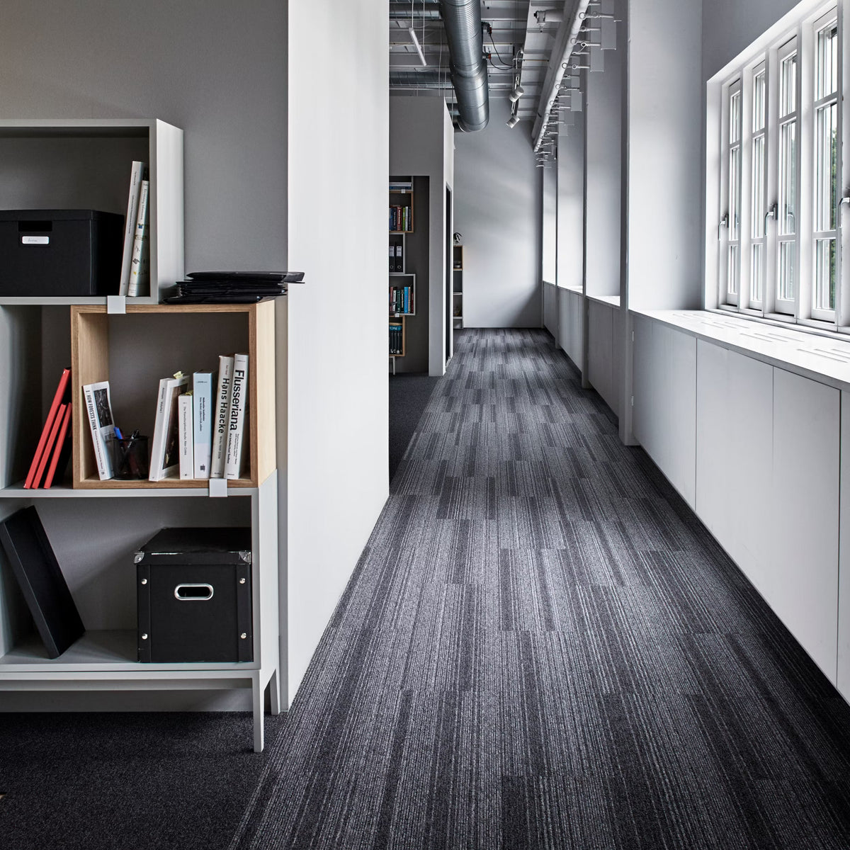 Interface Employ Loop Jet carpet tiles with Employ Dimensions in an office corridor