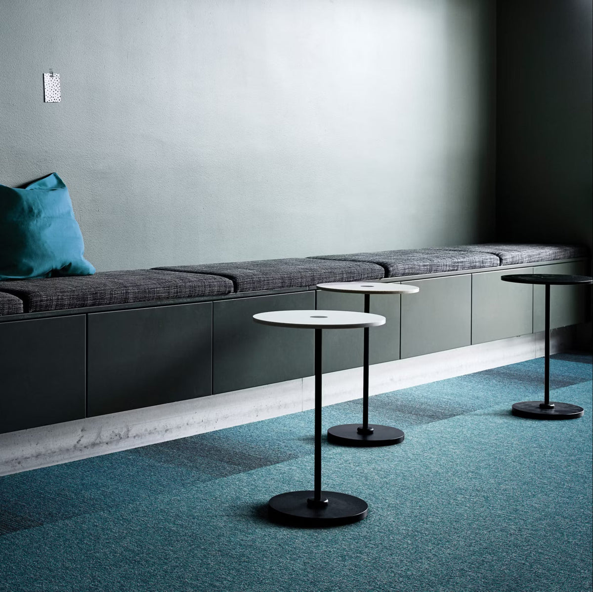 Interface Employ Loop Tropical carpet tiles with Employ Lines Caribbean in a breakout area