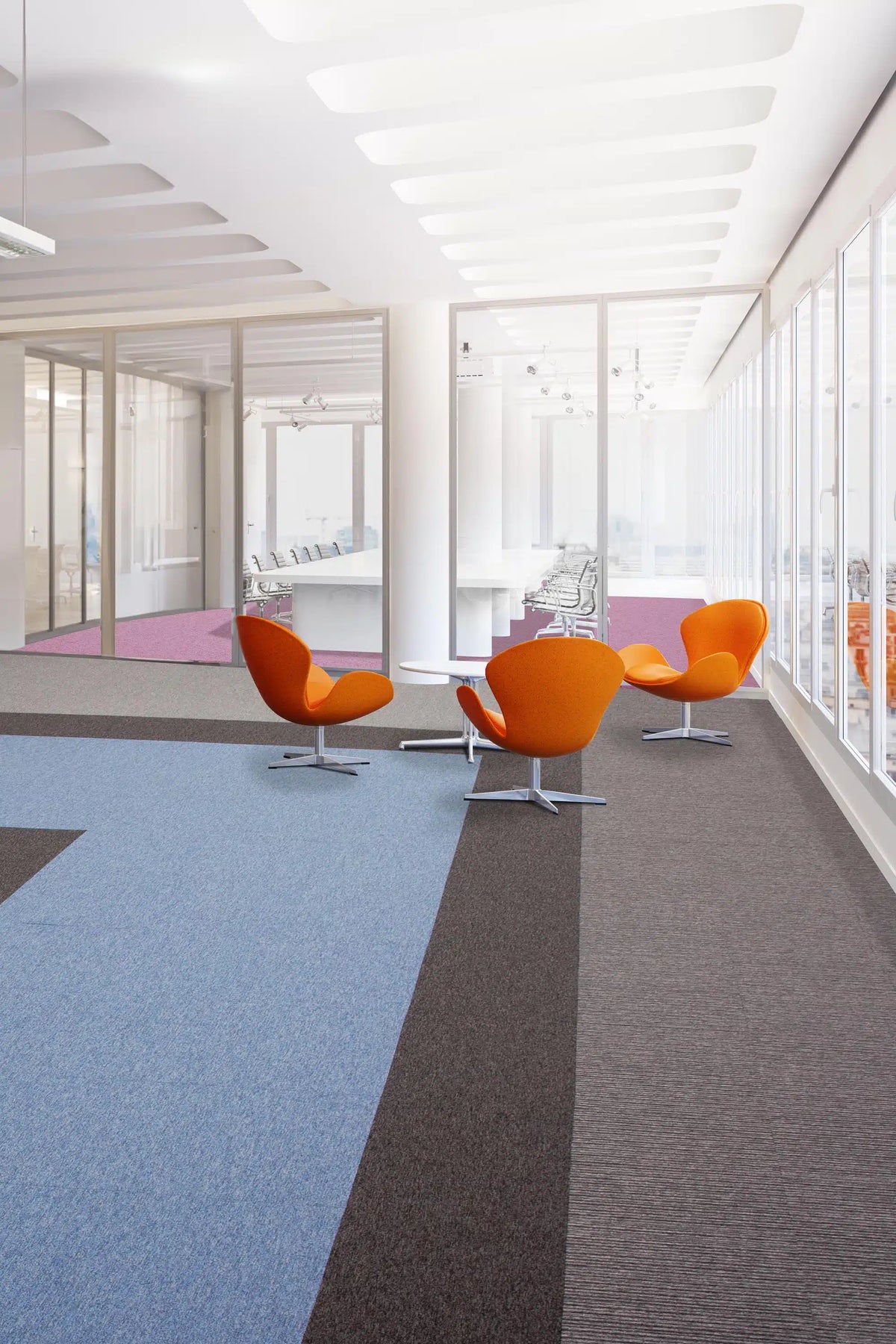Tivoli® carpet tiles in an office breakout area with orange chairs - installation example for Tivoli® Carpet Tiles in Barbados Blue